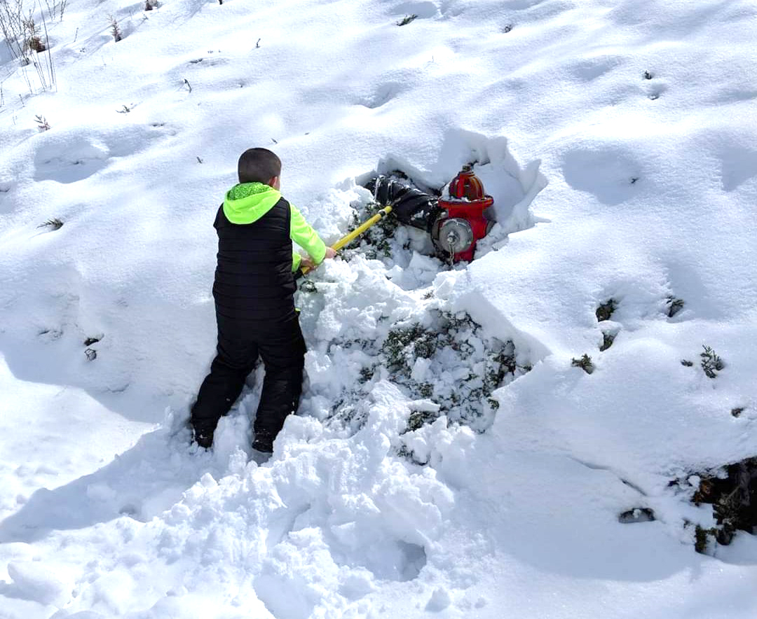 child clearing hydrant